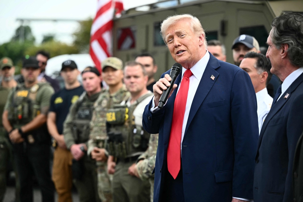 US President Donald Trump speaks while visiting federal troops at the US Park Police Anacostia operations facility in Washington, DC, on August 21, 2025. — AFP pic