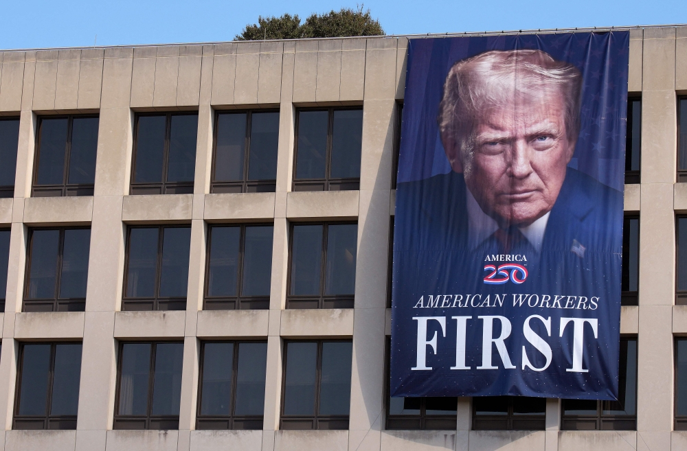 A photo of US President Donald Trump is displayed on the side of the US Department of Labor on August 25, 2025, in Washington, DC. — AFP pic