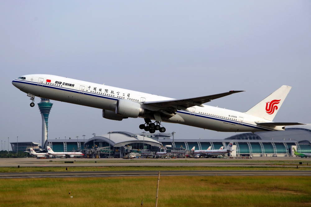 An Air China Boeing 777-39L(ER) aircraft with the registration B-2088 is seen at Guangzhou Baiyun International Airport. — Photo by byeangel licensed under CC BY 2.0