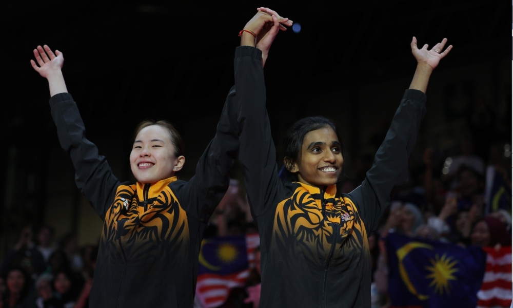For national top women’s doubles shuttler M. Thinaah (right), stepping onto the court with her partner Pearly Tan is more than just playing badminton — it is a living reminder of the power of unity in a diverse Malaysia. — AFP pic