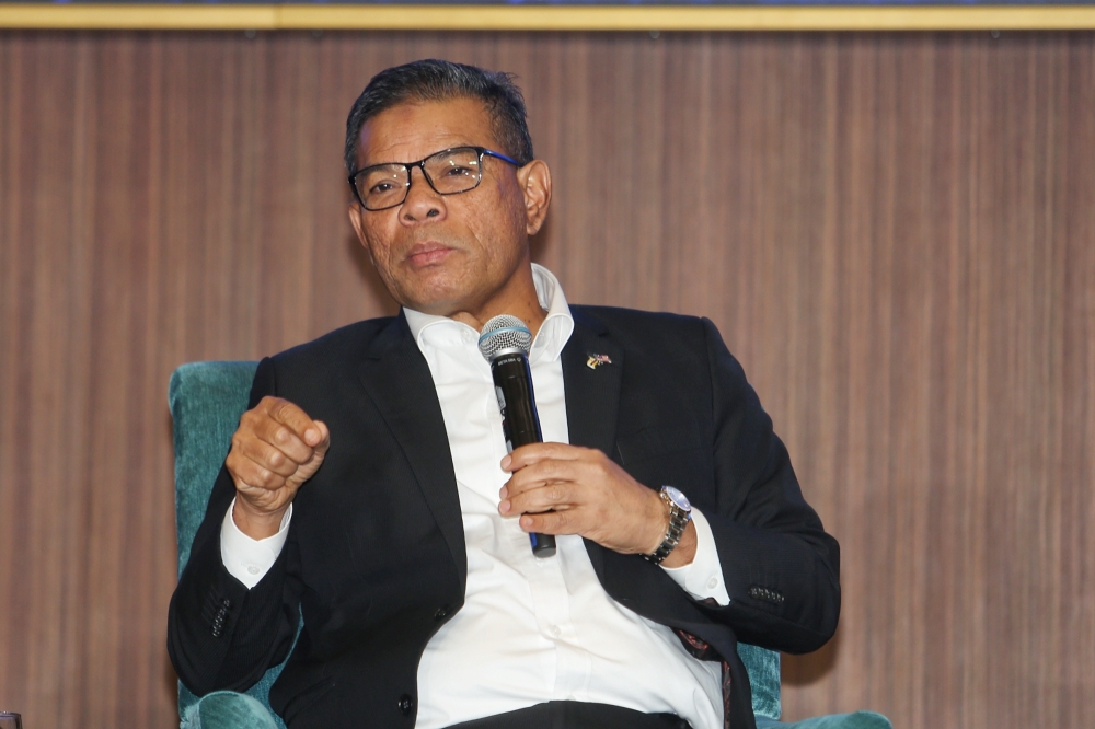 Home Affairs Minister Datuk Seri Saifuddin Nasution Ismail said the police have arrested a total of 11,864 individuals believed to be involved in 31,949 cases of fraud involving losses of RM1.5 billion throughout this year. — Picture by Choo Choy May