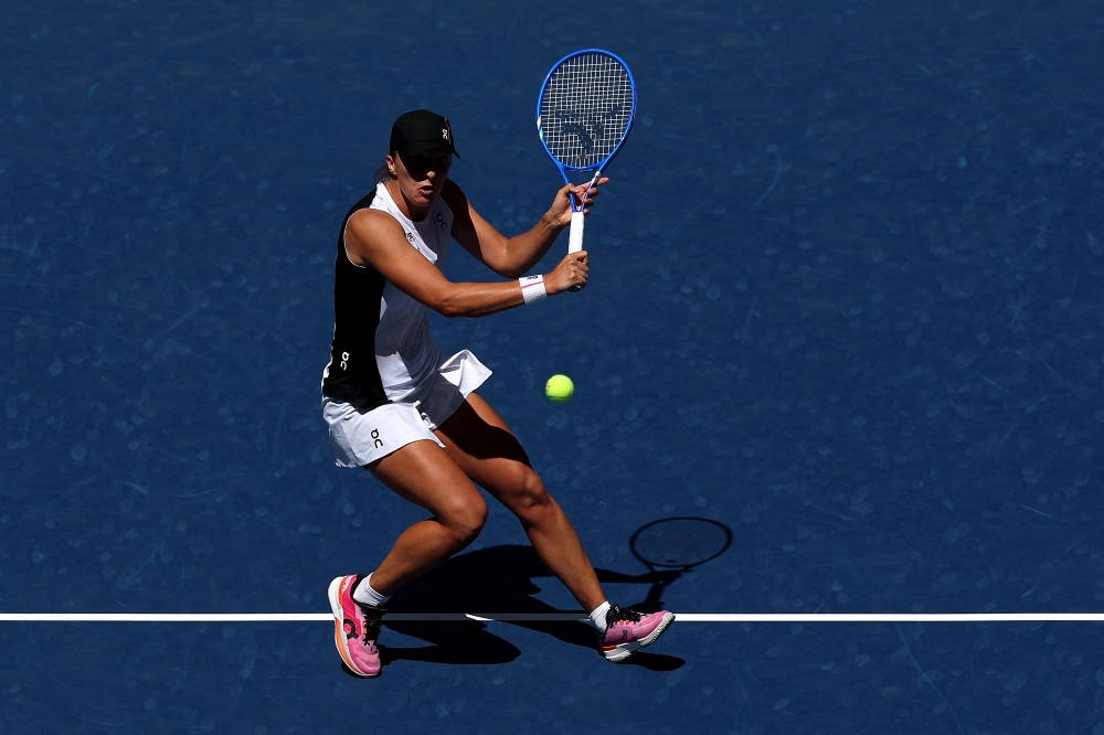 Iga Swiatek returns against Emiliana Arango during their women’s singles first round match at the 2025 US Open in New York August 26, 2025. — AFP pic