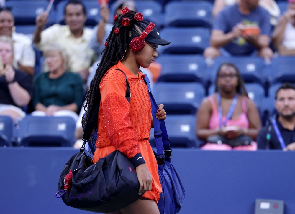 Naomi Osaka arrives before her first-round women’s singles match against Belgium’s Greet Minnen at the US Open in New York August 26, 2025. — Reuters pic