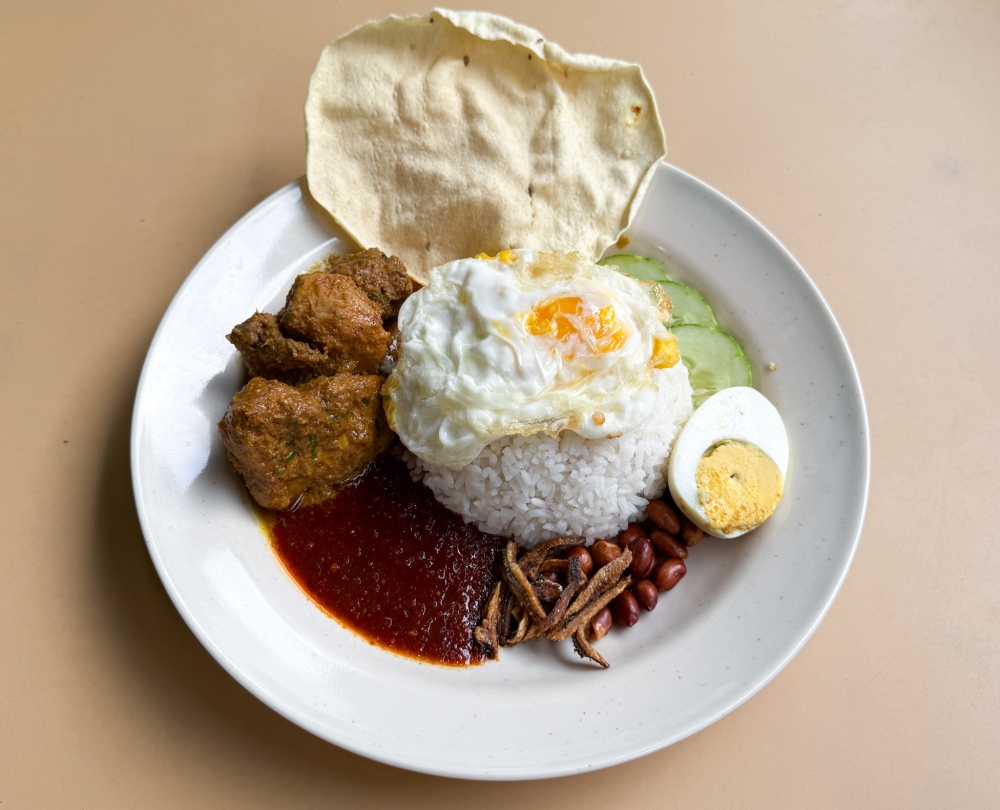 Or think about the long conversations people have while sipping on Zus coffee, debating whether the Spanish Latte really is better than the CEO Coconut Latte. And of course, the ultimate Malaysian question: whose nasi lemak is better? — Picture by Lee Khang Yi