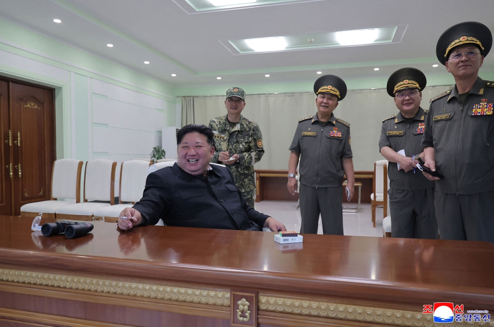 This picture taken on August 27, 2025 and released by North Korea's official Korean Central News Agency (KCNA) on August 28, 2025 shows North Korean leader Kim Jong Un (C) visiting the special operation training base directly under the authority of the General Staff of the Korean People's Army at an undisclosed location in North Korea. — Reuters pic