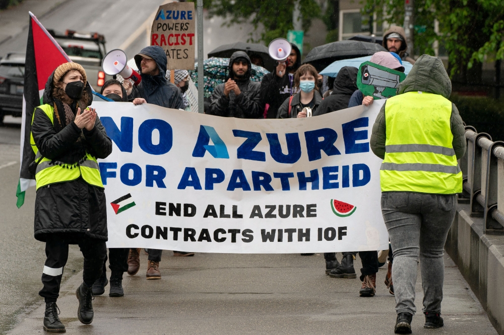 This file picture shows demonstrators marching near the Microsoft Build conference in Seattle on May 21, 2024, calling for an end to Microsoft’s Azure contracts with Israel. — Reuters pic