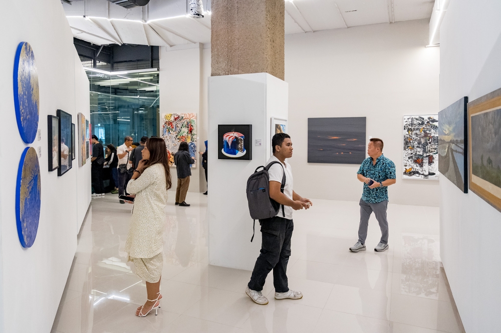 Visitors check out the ‘RASA’ Merdeka!’ art exhibition at Ruang Teduh gallery on its launch day at Exchange 106, Tun Razak Exchange in Kuala Lumpur on August 28, 2025. — Picture by Firdaus Latif