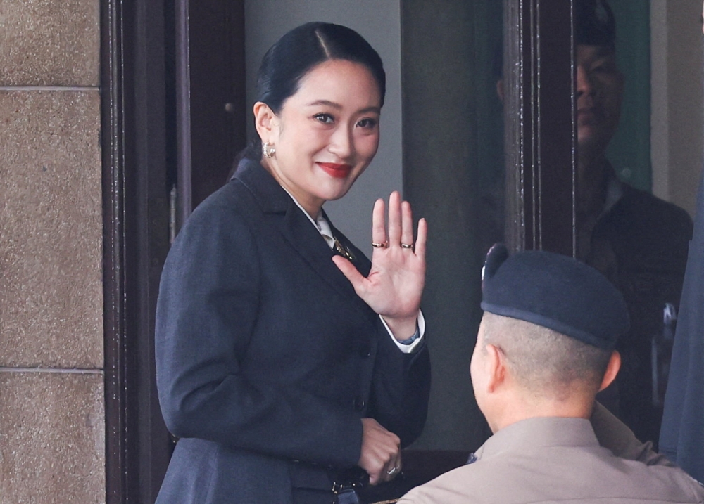 Suspended Thai Prime Minister Paetongtarn Shinawatra arrives at Government House in Bangkok ahead of the Constitutional Court’s verdict in a high-profile ethics case over a leaked phone call with former Cambodian leader Hun Sen. — Reuters pic