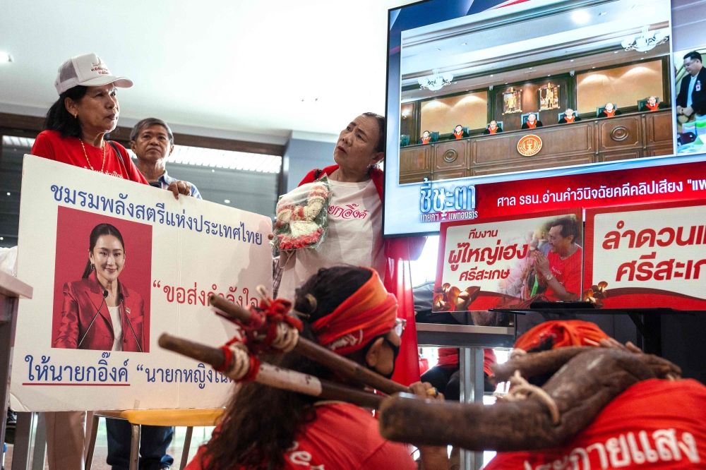 Supporters watch as Thailand’s Constitutional Court sacks PM Paetongtarn Shinawatra and her cabinet in Bangkok, August 29, 2025. — AFP pic