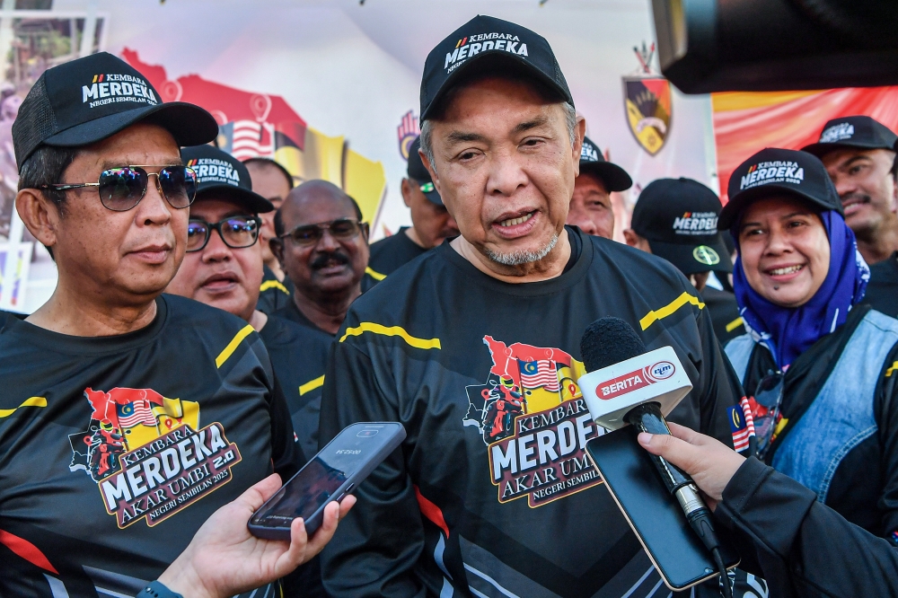 Deputy Prime Minister Datuk Seri Dr Ahmad Zahid Hamidi speaks to reporters at the Kembara Merdeka Akar Umbi 2.0 programme at Dataran Majlis Perbandaran Jempol today. — Bernama pic