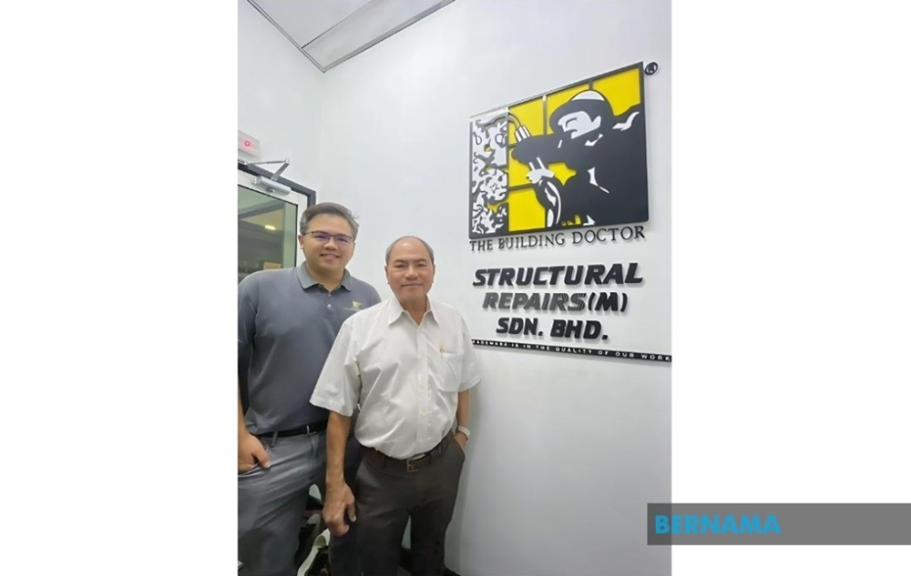 Yong Zi Lip and Robert Yong are seen at Structural Repairs (M) Sdn Bhd. — Bernama pic