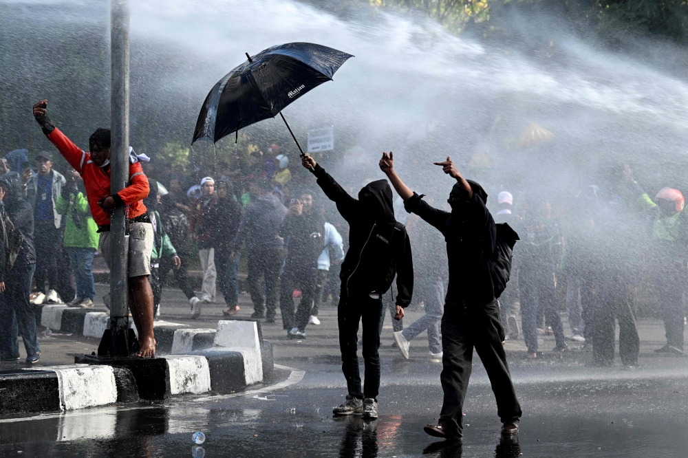 Indonesia was rocked by protests in major cities, including Jakarta, a day earlier, after footage showed a motorcycle taxi driver being run over by a police tactical vehicle during rallies against low wages and financial perks for lawmakers. — AFP pic