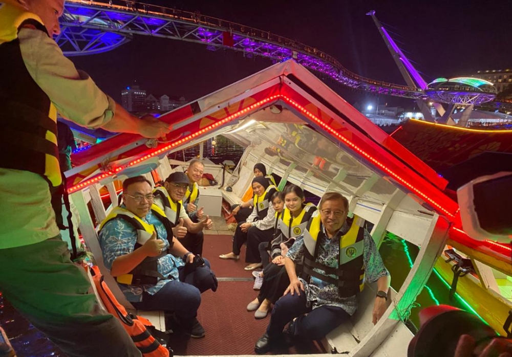 Abang Johari (right) with other Sarawak officials take the first ride in the state’s first smart city electric ‘penambang’ fleet in Kuching on August 30, 2025. — The Borneo Post pic