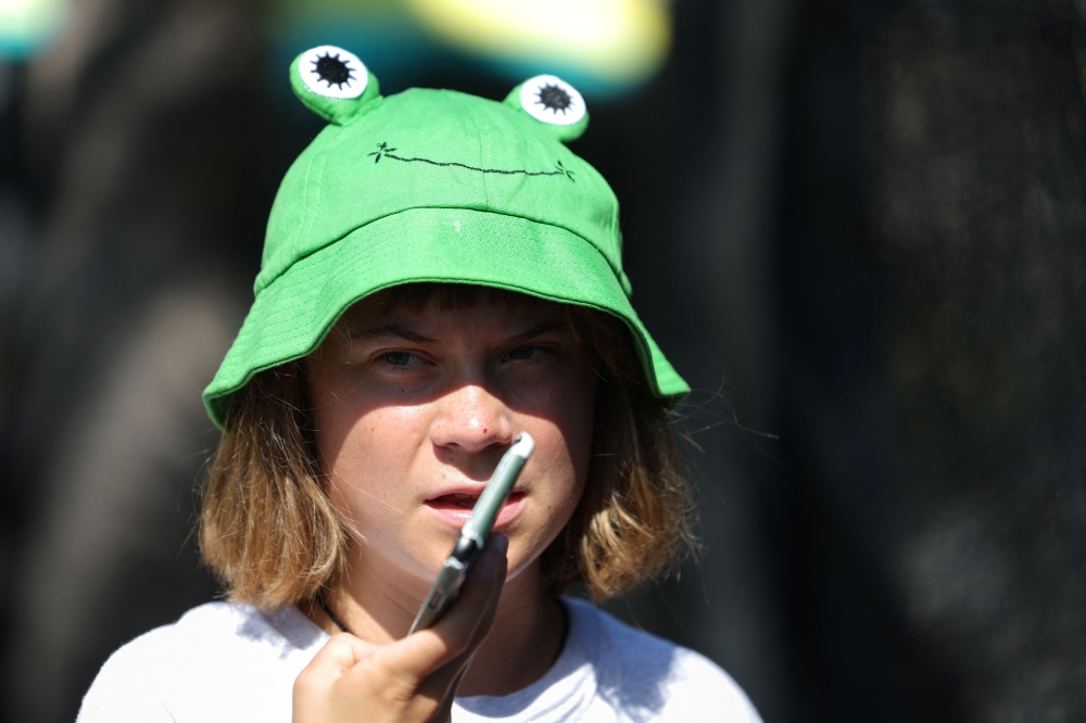 Swedish climate activist Greta Thunberg arrives at the launch of a civilian flotilla aimed at breaking the Israeli blockade of the Gaza Strip, in Barcelona, on August 31, 2025. — AFP pic