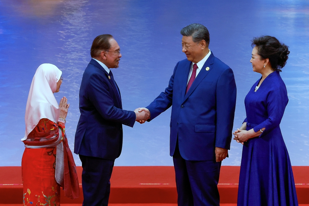 Prime Minister Datuk Seri Anwar Ibrahim shakes hands with Chinese President Xi Jinping as the latter greeted and welcomed him to the Shanghai Cooperation Organisation (SCO) Summit 2025 Gala Dinner at Tianjin Meijiang Convention Centre (TMCC) in Tianjin August 31, 2025. — Bernama pic