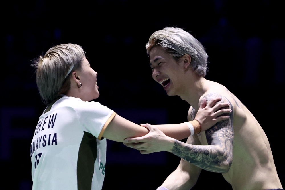 Malaysia’s Chen Tang Jie (right) reacts with Toh Ee Wei after beating China’s Jiang Zhen Bang and Wei Ya Xin in the mixed doubles final match at the Badminton BWF World Championships in Paris August 31, 2025. — AFP pic