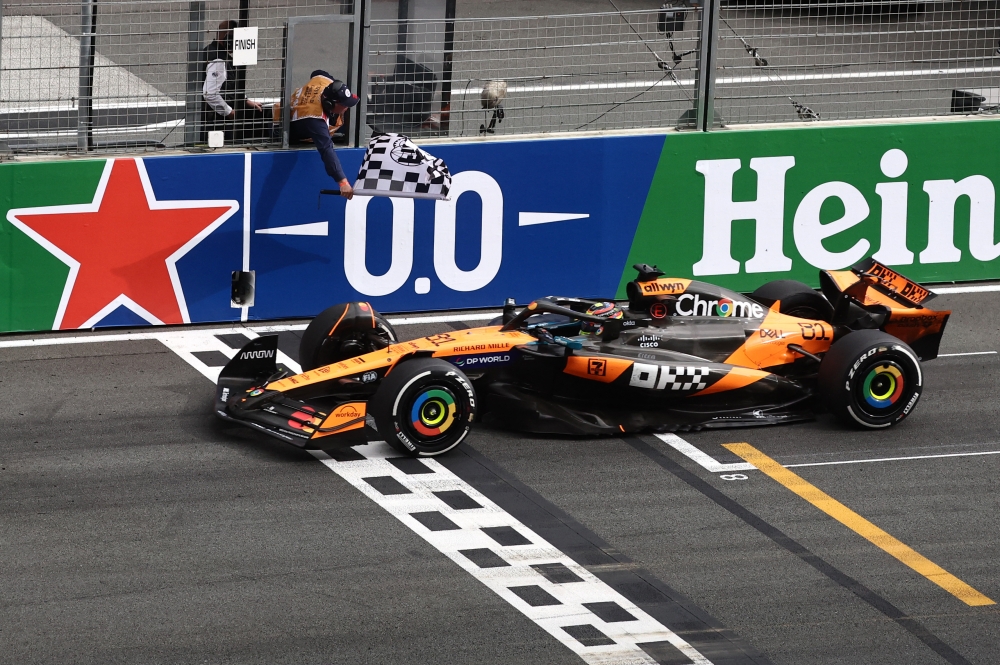 McLaren’s Oscar Piastri passes the chequered flag to win the Dutch Grand Prix in Zandvoort August 31, 2025. — Reuters pic
