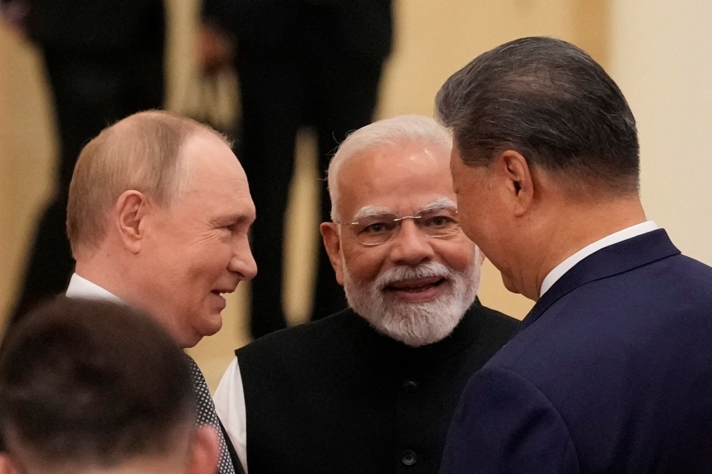Indian Prime Minister Narendra Modi talks with Russian President Vladimir Putin and Chinese President Xi Jinping ahead of the Shanghai Cooperation Organization (SCO) Summit 2025 in Tianjin September 1, 2025. — Reuters pic 