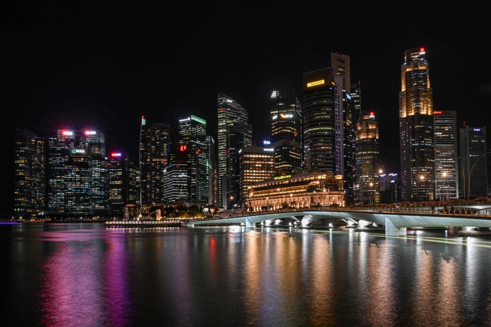 Singapore police said the suspect was detained on Saturday after staff at a United Overseas Bank (UOB) branch flagged his withdrawal request as suspicious. — AFP pic