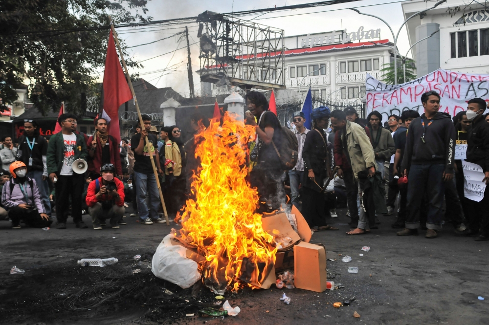 Protesters gather near items being burned outside the regional parliament building during a protest against the government’s spending priorities, such as enhanced perks for lawmakers, in Bandung, West Java province, Indonesia, September 1, 2025. — Reuters pic 