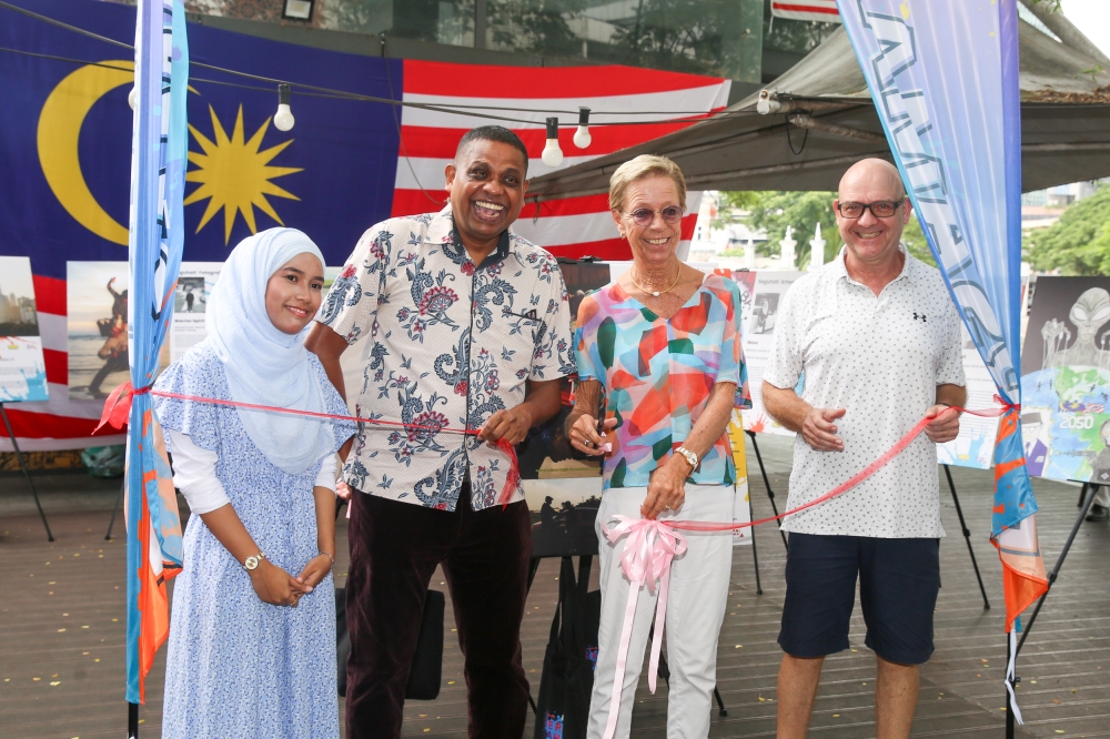 And the ribbon’s cut. Officiating the exhibition on Aug 31, 2025, at the River of Life, from left to right, Ameera Ameelia Abdul Razak (project coordinator), Praba Ganesan (MyKampus Radio, GM), Angela Burchardt (Founder/Chairwoman, Terramed Physio & Rehab), Jörg Teichmann (Founder/Managing Director, Terramed Physio & Rehab). —  Picture by Choo Choy May