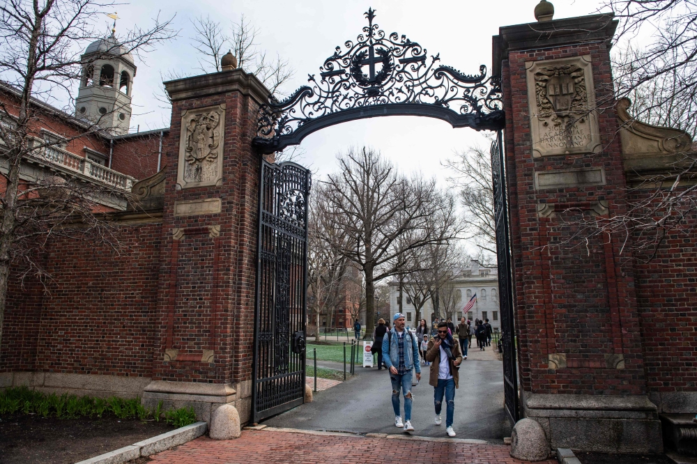  People walk through a gate as they exit Harvard Yard on the campus of Harvard University campus in Cambridge, Massachussetts, on April 15, 2025. — AFP file pic 