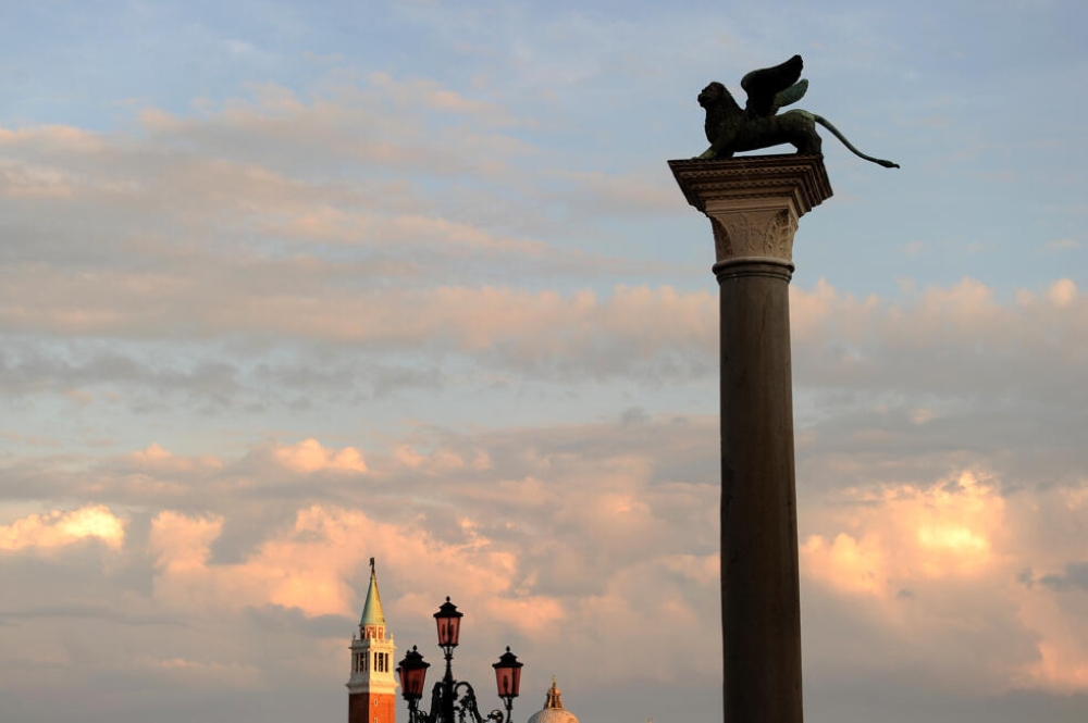 The Lion of Venice sculpture sits on top of a column in Piazza San Marco. — AFP pic