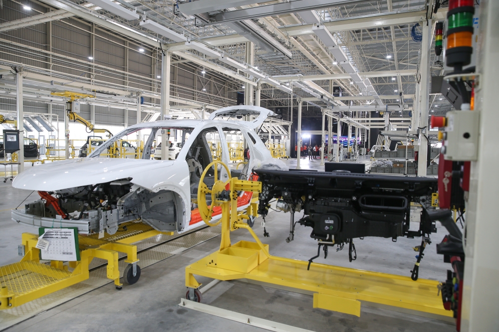 Vehicle bodies being assembled at Proton’s new EV plant in Tanjung Malim, Perak, which began full-scale operations this month, September 4, 2025. — Picture by Yusof Isa