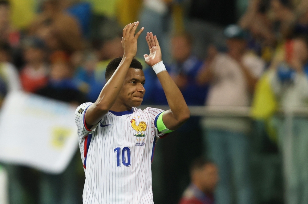 France forward Kylian Mbappe said equalling Thierry Henry’s tally of 51 international goals was an honour, but added that surpassing Olivier Giroud’s all-time record was not something he dwells on, as his focus stays on winning titles with Les Bleus. — Reuters pic  