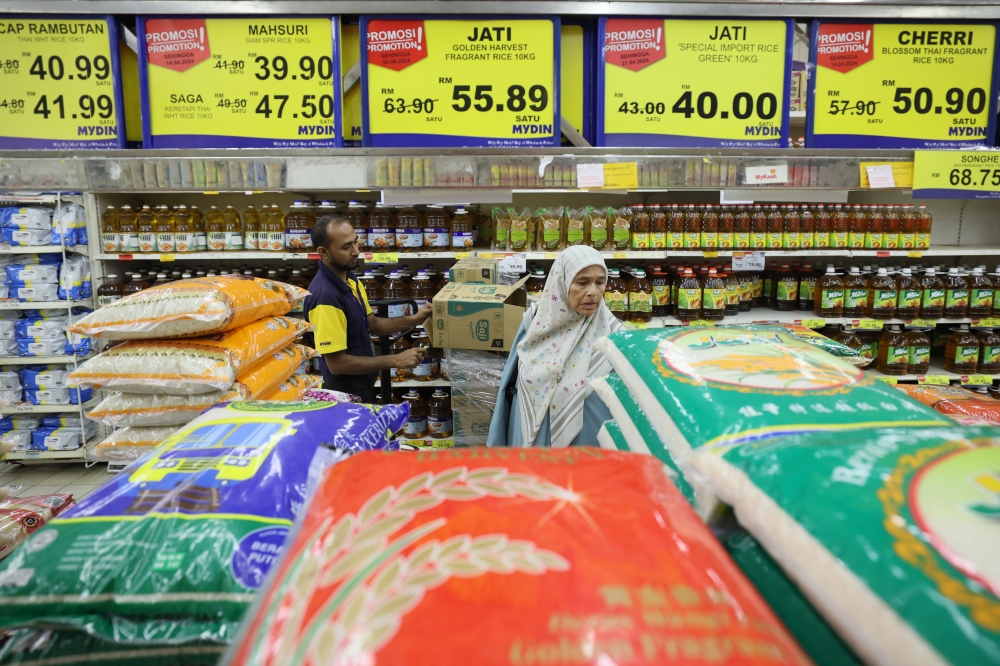 Datuk Seri Mohamad Sabu said when imported rice is sold at a price not much different from the local price, local rice is left behind. — Bernama pic