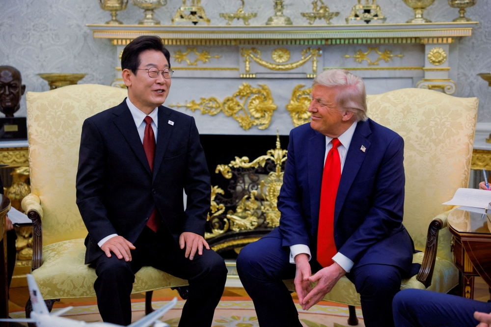 South Korean President Lee Jae Myung (left) is seen here with US President Donald Trump at the White House, in Washington DC, August 25, 2025. Both their countries have been at odds over the details of a trade deal that includes US$350 billion of South Korean investment in the United States.— Reuters pic