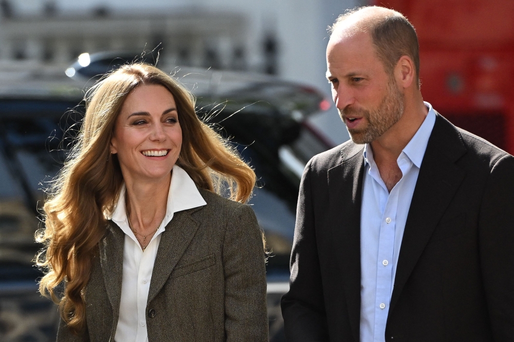 Prince William, Prince of Wales and Catherine, Princess of Wales react during a visit to the Natural History Museum. — AFP pic