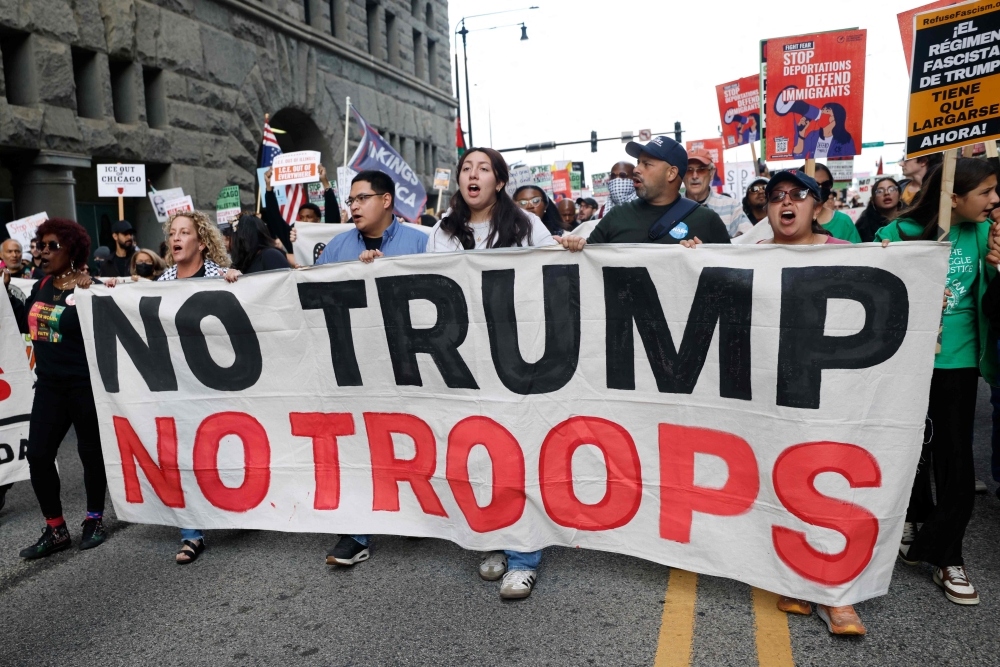 People participate in a demonstration against the planned deployment of National Guard troops in Chicago September 6, 2025. — AFP pic 