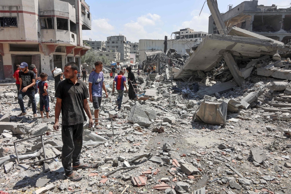 Palestinians check the rubble after an Israeli strike levelled the al-Tawheed Wal Sunna mosque in the Daraj neighbourhood of Gaza City on September 7, 2025. — AFP pic