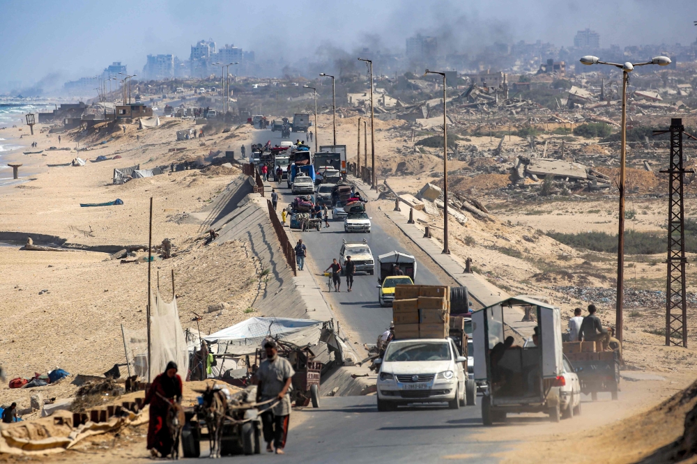 Vehicles move along the coastal road used by displaced people evacuating southbound from Gaza City, in Nuseirat in the central Gaza Strip, on September 9, 2025. United Nations (UN) Secretary-General Antonio Guterres warned that the world is spending far more on waging wars than on building peace. — AFP pic