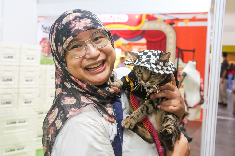 Metallica and her owner Karin. — Picture by Choo Choy May