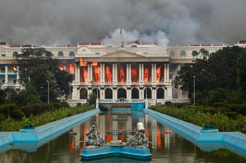 Fire rages through the Singha Durbar, the main administrative building for the Nepal government, in Kathmandu on September 9, 2025, a day after a police crackdown on demonstrations over social media prohibitions and corruption by the government. — AFP pic 