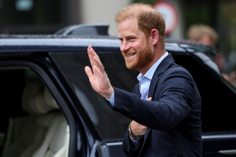 Britain’s Prince Harry, Duke of Sussex waves as he departs the Centre for Blast Injury Studies, at the Imperial College in London, on September 10, 2025. — AFP pic