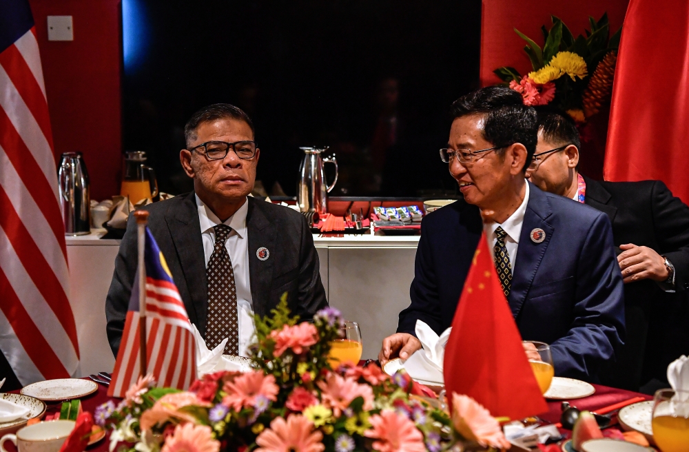 Home Minister Datuk Seri Saifuddin Nasution Ismail in a bilateral discussion with China Vice Minister of Public Security and Commissioner of National Immigration Administration (NIA), PRC, Wang Zhizhong at the 19th Asean Ministerial Meeting on Transnational Crime (AMMTC) and its related meetings in Melaka, September 11, 2025. — Bernama pic 