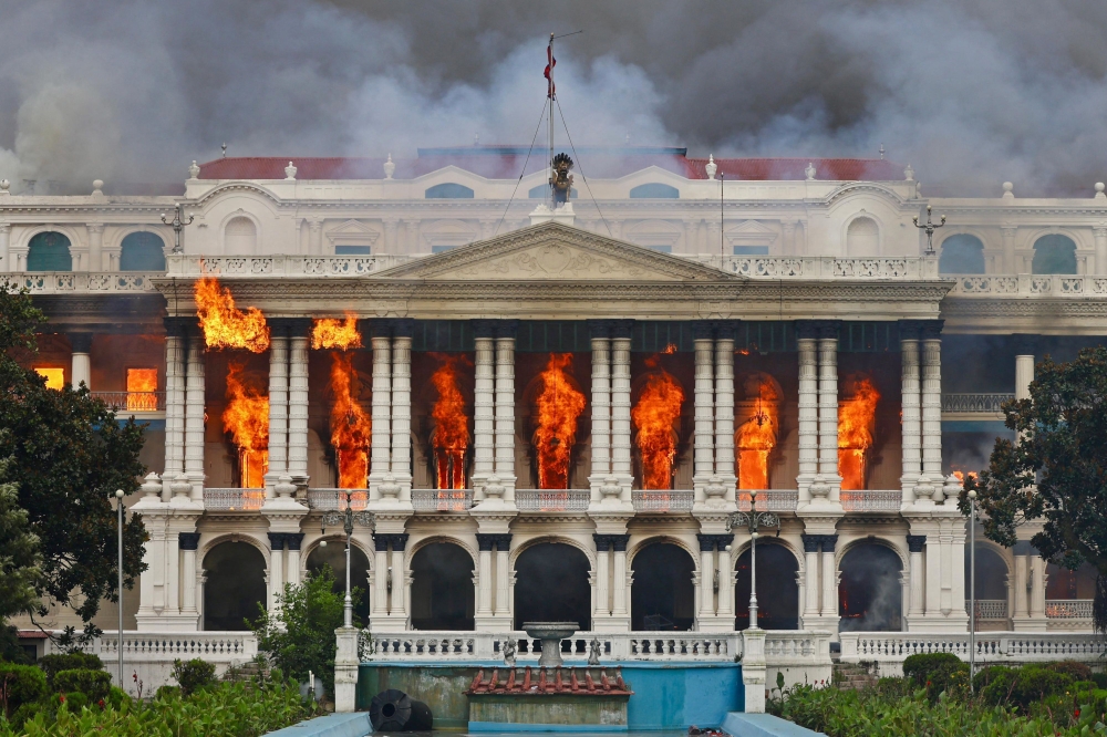 Fire rages through the Singha Durbar, the main administrative building for the Nepali government, in Kathmandu on September 9, 2025. — AFP pic