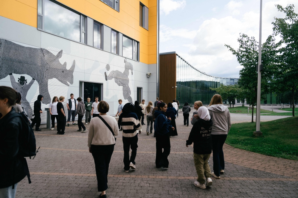 Students interact outside the Kungsvagens skola comprehensive Swedish-speaking school on August 21, 2025 in Sipoo, Finland. — AFP pic