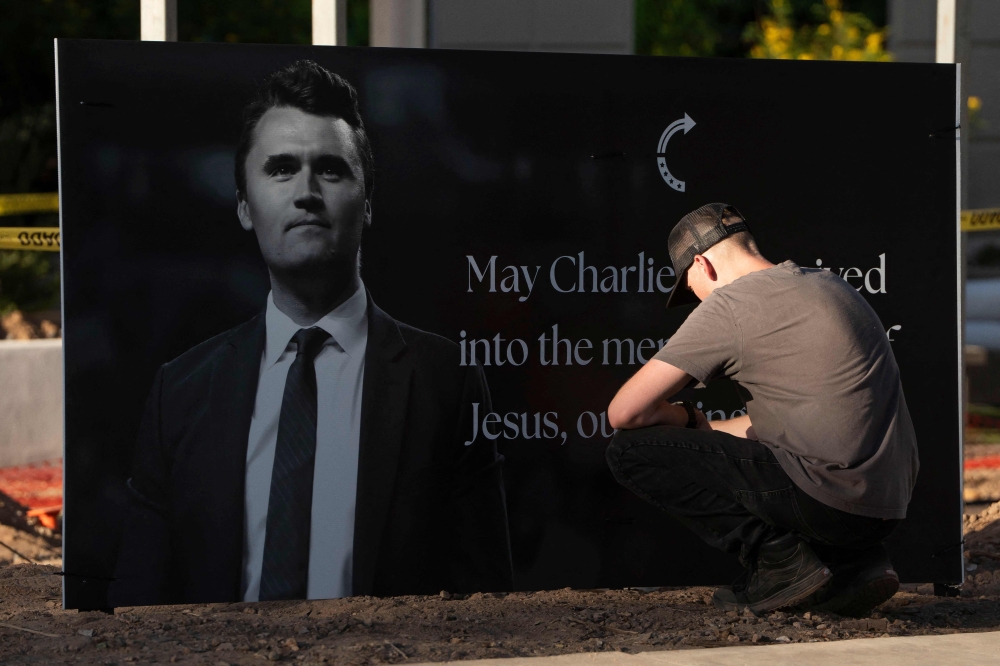 Arizonans mourn Turning Point USA Founder Charlie Kirk outside of the Turning Point USA headquarters on September 10, 2025 in Phoenix, Arizona. — AFP pic