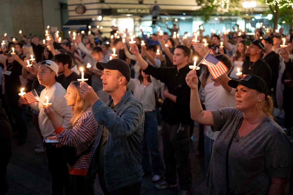 Attendees hold candles during a candlelight vigil and prayer event for Turning Point USA Founder Charlie Kirk on September 10, 2025 in Seattle, Washington. — AFP pic