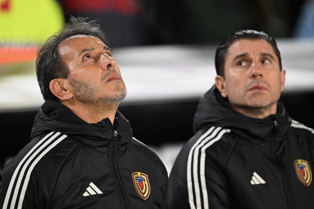 Venezuela sacked coach Fernando Batista (left) on Wednesday night, a day after their World Cup qualification dream died. — AFP pic