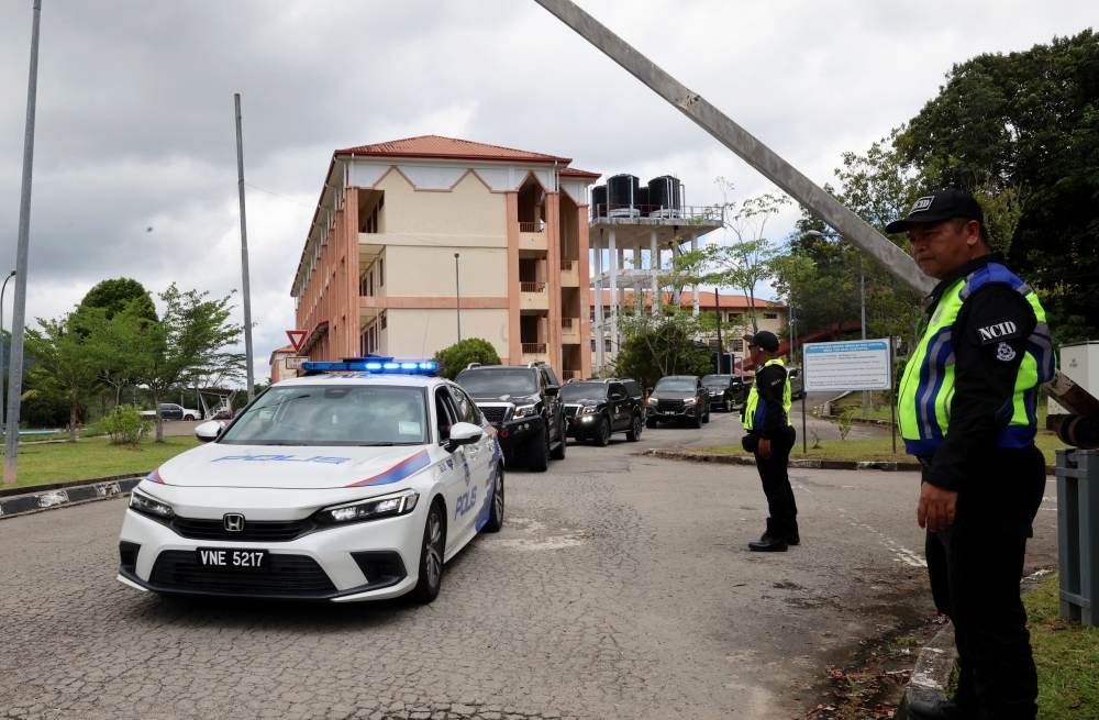 A vehicle carrying the Kota Kinabalu Court Coroner exited the grounds of Tun Datu Mustapha Limauan National Secondary School in Papar, September 11, 2025. — Bernama pic 