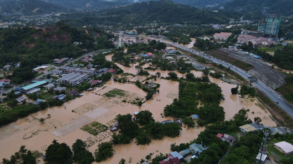 Flood-prone Penampang district has once again been hit by floods after days of intermittent rain. — Picture by Philip Chin