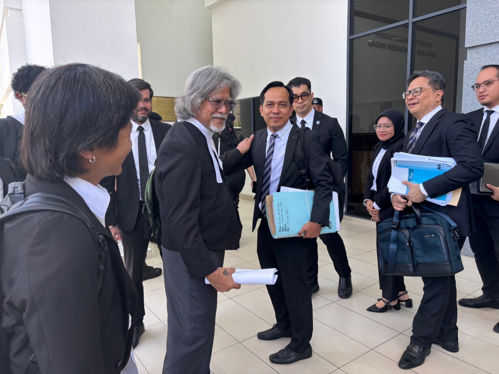 Shahlan (right) and Ram (left) at the Kota Kinabalu Court Complex.