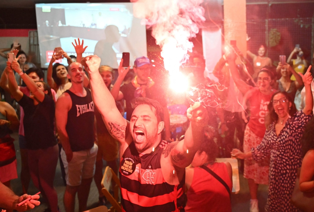 People celebrate in Brasilia, Brazil, on September 11, 2025, after the Supreme Court convicted former president Jair Bolsonaro of plotting a coup. — AFP pic