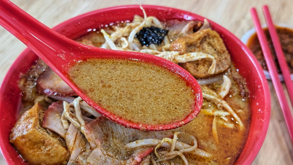 This curry is punchy and spicy, thick with spices and aromatics, rather than laden with coconut milk. — Picture by Ethan Lau