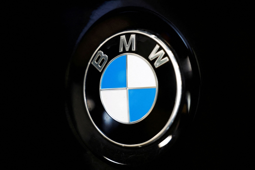 The BMW logo is seen inside a car dealer in Nijmegen, Netherlands on February 26, 2025. — Reuters pic